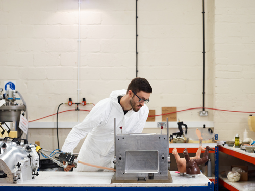 An Engineer checks a production tool.