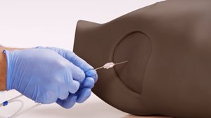 Chest Drain & Needle Decompression Trainer in dark skin tone needle insertion