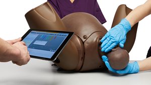 Birth demonstration using the Advanced Birthing Simulator PROMPT Flex in dark skin tone 