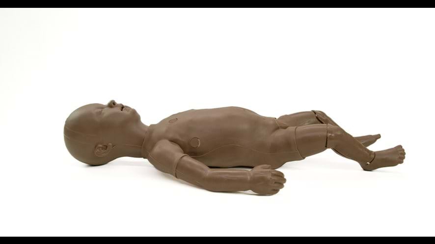 Trubaby X Manikin with airway management simulation to practice critical procedures in dark skin tone from Trucorp