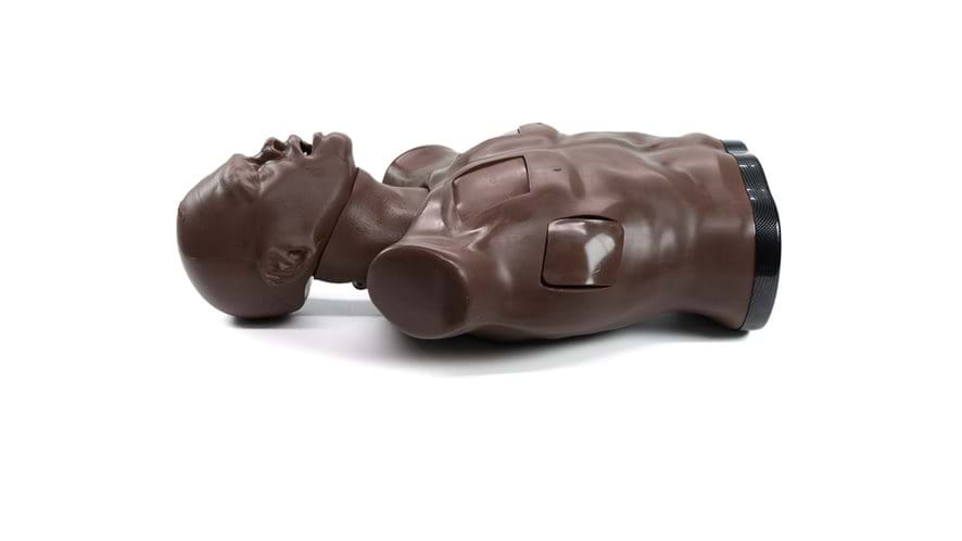 Trauman Trauma Torso in Dark skin tone by Trucorp used for practice of emergency airway procedures