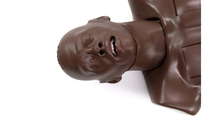 Trauman Trauma Torso in Dark skin tone by Trucorp used for practice of emergency airway procedures